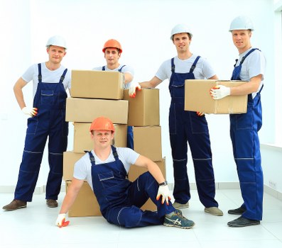 Safety-focused removal van work near a property entrance